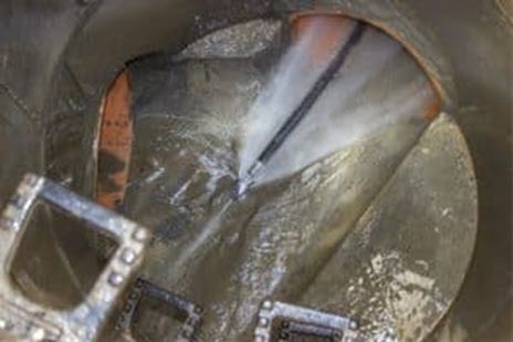 A sewer drain being cleared with hydro jetting